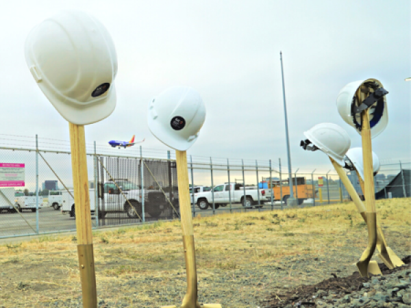 Shovels and helmets at groundbreaking ceremony.
