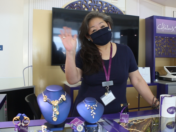 Chief Gemologist Cecilia Wong welcomes passengers to Chaleux